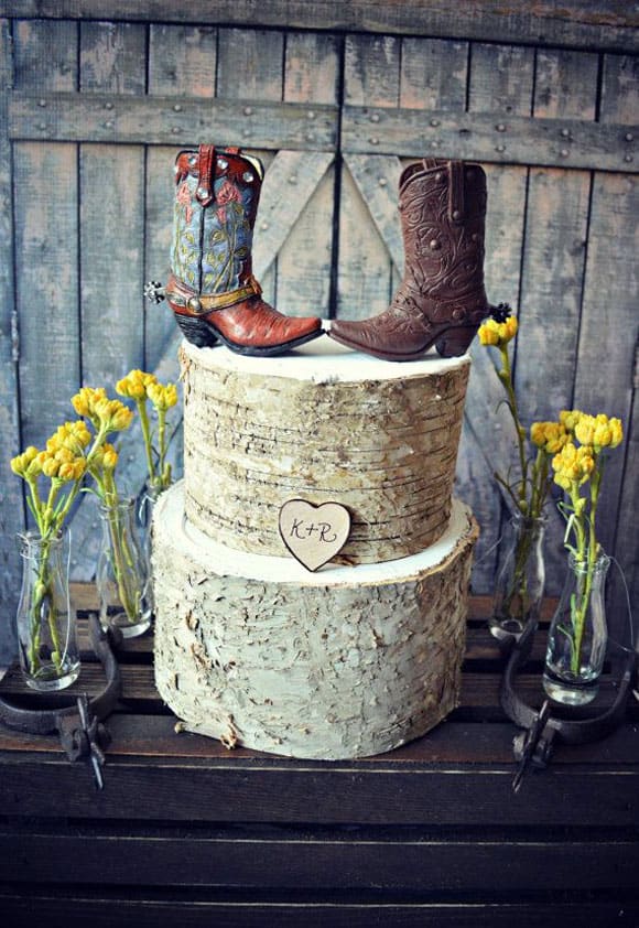 Rustic wedding cake with cowboy boot toppers