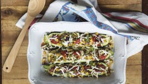 calabacitas rellenas with homemade queso blanco on a tray with a spoon recipe cowgirl magazine